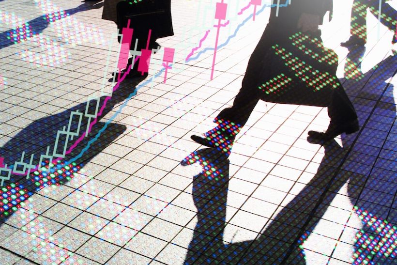 Person walking with images of data concepts superimposed over the image