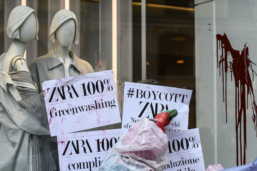 Boycott signs on Zara store window