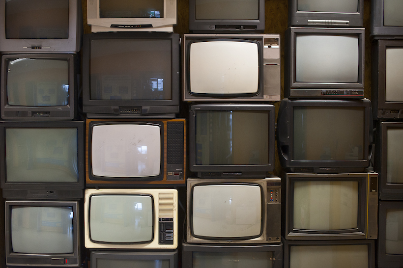 Stacks of old CRT TVs