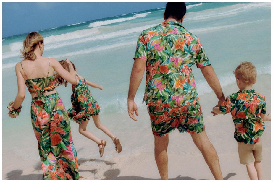 A family on a beach in matching clothes
