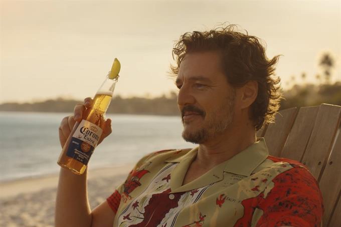Pedro Pascal holding bottle of Corona beer