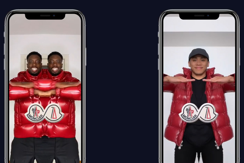 Two smart phones displaying people wearing Moncler jackets